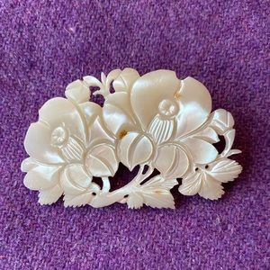 Carved shell brooch